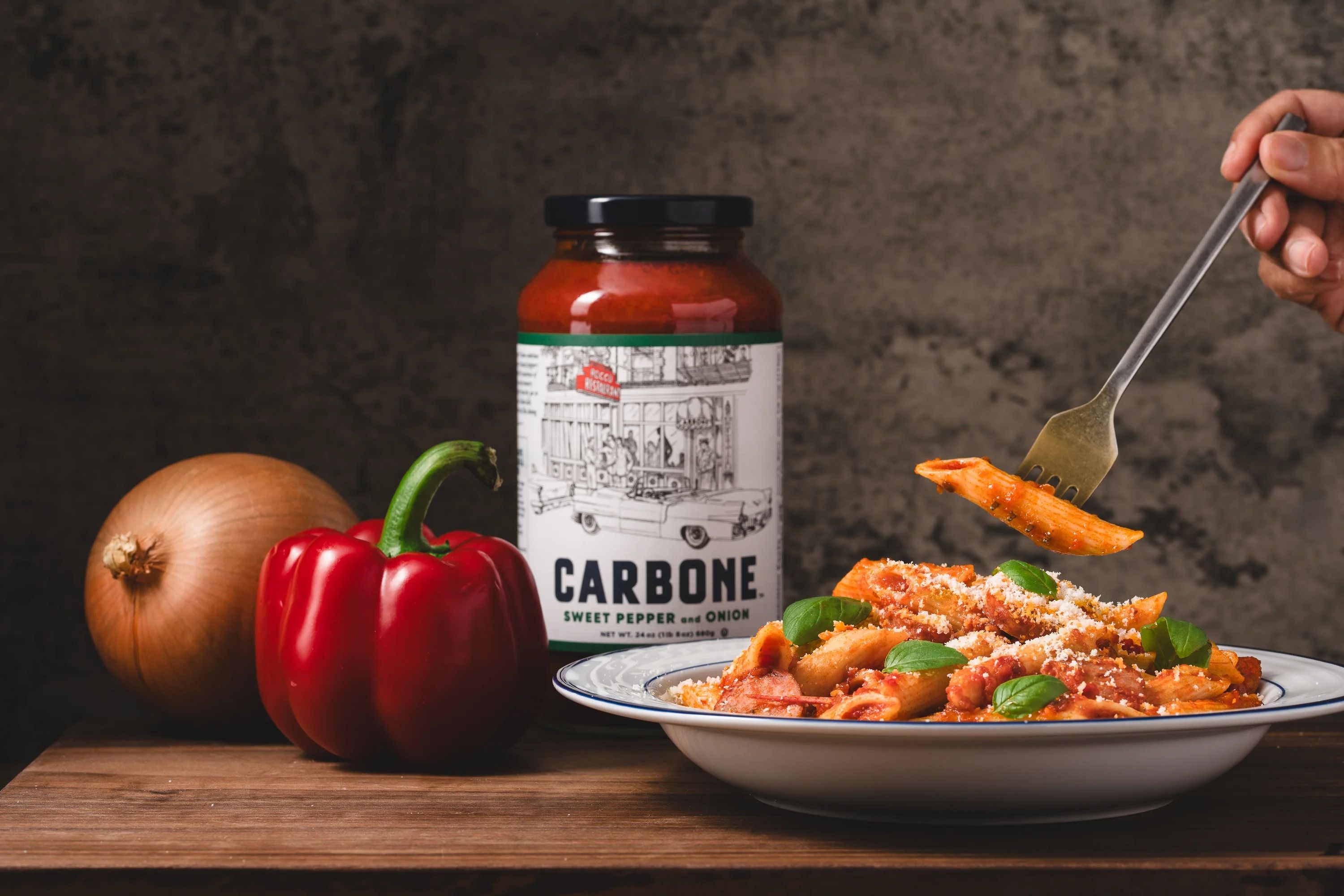 Penne rigate plated with sauce